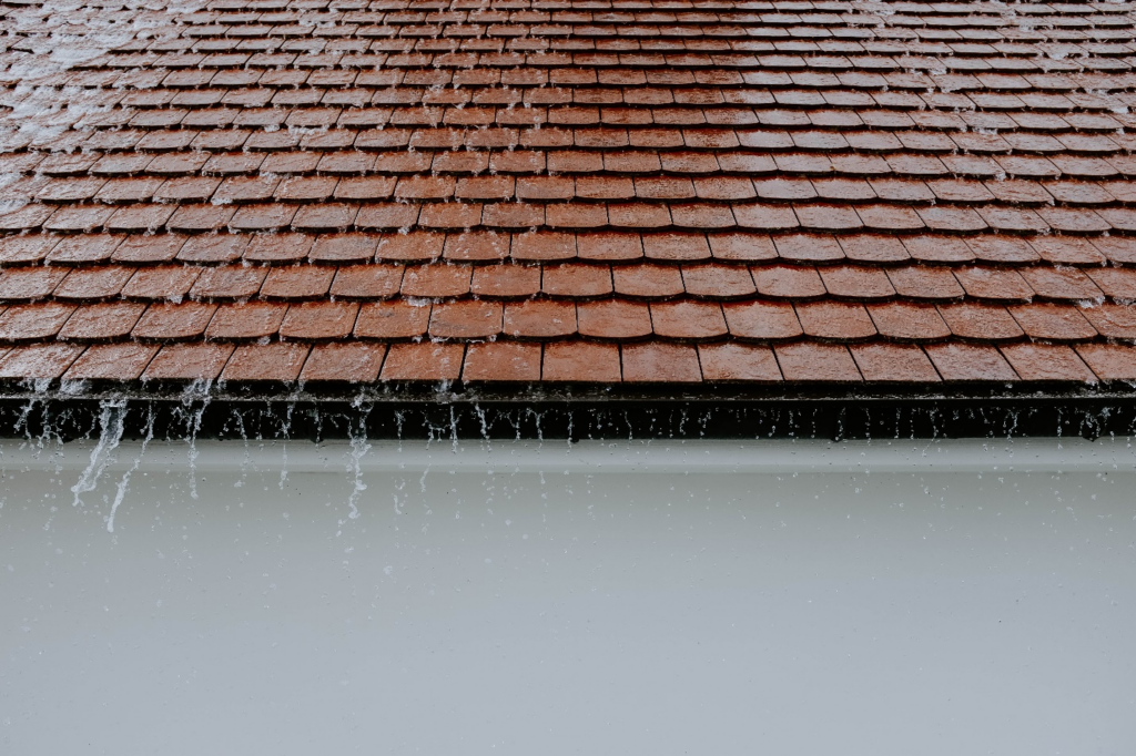 Rainwater sliding down the roof